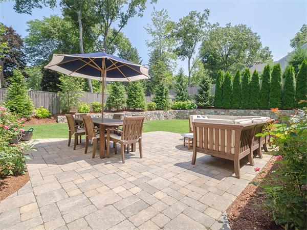 79 Pilgrim Road Wellesley, MA 02481 - Photo 2 of 30 an outdoor space with furniture and umbrella