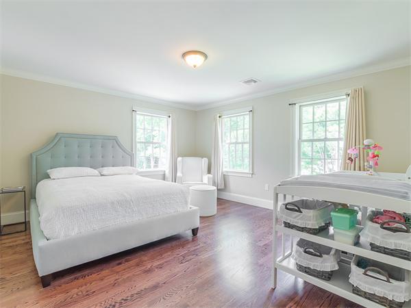 79 Pilgrim Road Wellesley, MA 02481 - Photo 22 of 30 a bedroom with a bed and a couch