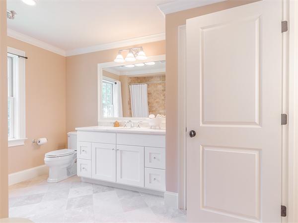 79 Pilgrim Road Wellesley, MA 02481 - Photo 23 of 30 a bathroom with a toilet a sink and a mirror