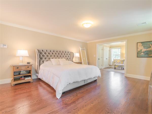 79 Pilgrim Road Wellesley, MA 02481 - Photo 24 of 30 a bedroom with a bed and wooden floor