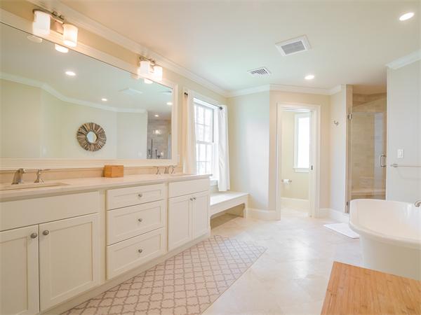 79 Pilgrim Road Wellesley, MA 02481 - Photo 26 of 30 a spacious bathroom with a mirror a sink and a shower