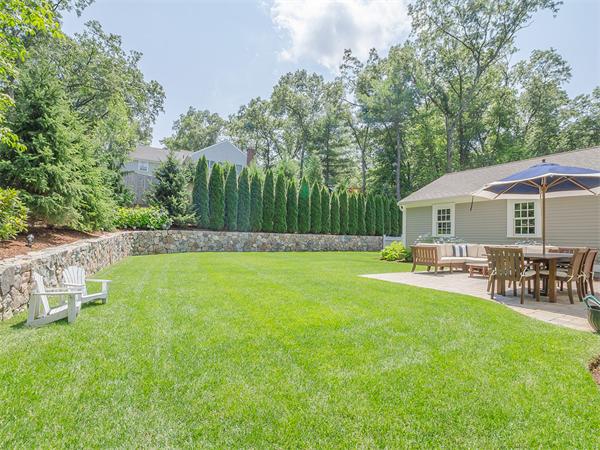 79 Pilgrim Road Wellesley, MA 02481 - Photo 3 of 30 a view of a house with a yard patio and sitting area