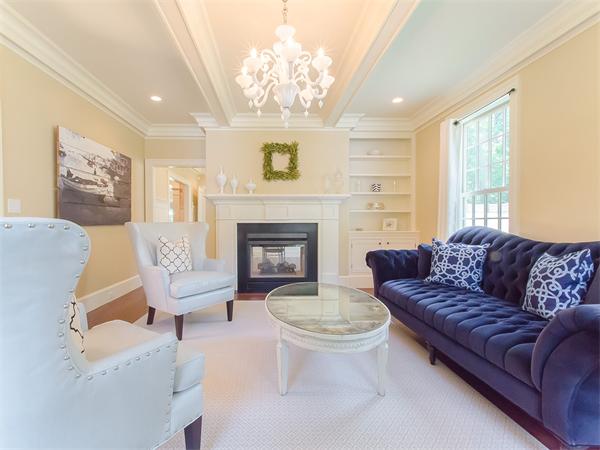 79 Pilgrim Road Wellesley, MA 02481 - Photo 7 of 30 a living room with furniture a fireplace and a large window