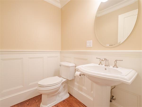 79 Pilgrim Road Wellesley, MA 02481 - Photo 10 of 30 a bathroom with a sink a mirror and a toilet