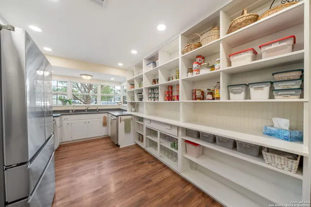 a kitchen with stainless steel appliances a stove and a refrigerator