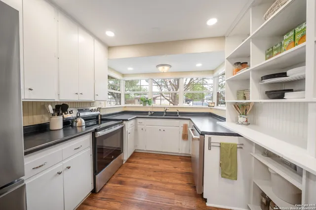 a kitchen with a sink and cabinets
