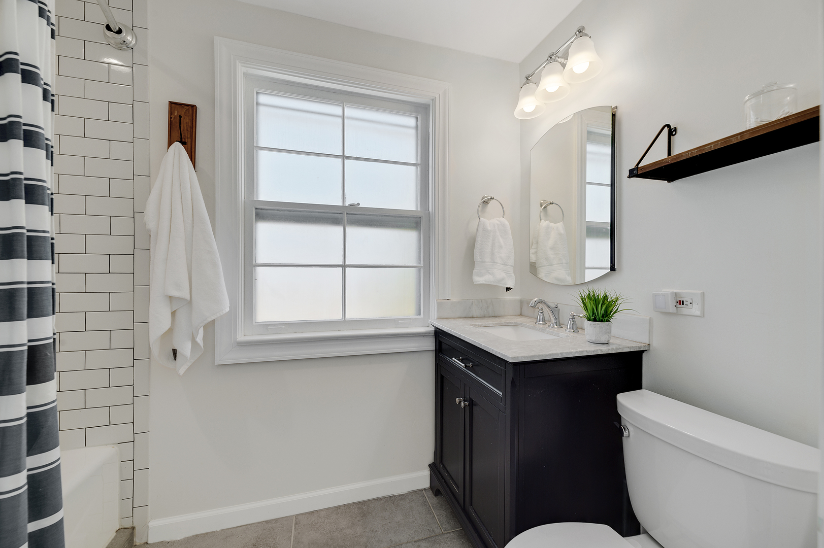 2309 2nd Avenue North Riverside, IL 60546 - Photo 17 of 22 a bathroom with a toilet sink and mirror