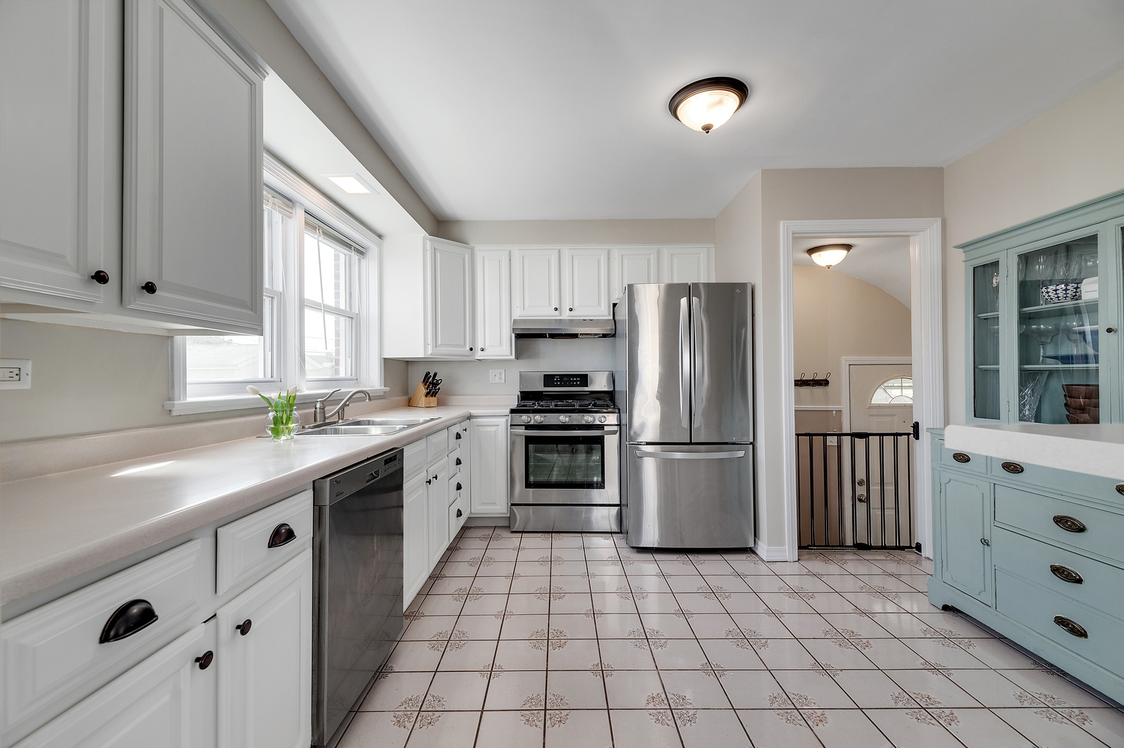 2309 2nd Avenue North Riverside, IL 60546 - Photo 9 of 22 a kitchen with granite countertop a refrigerator and a sink