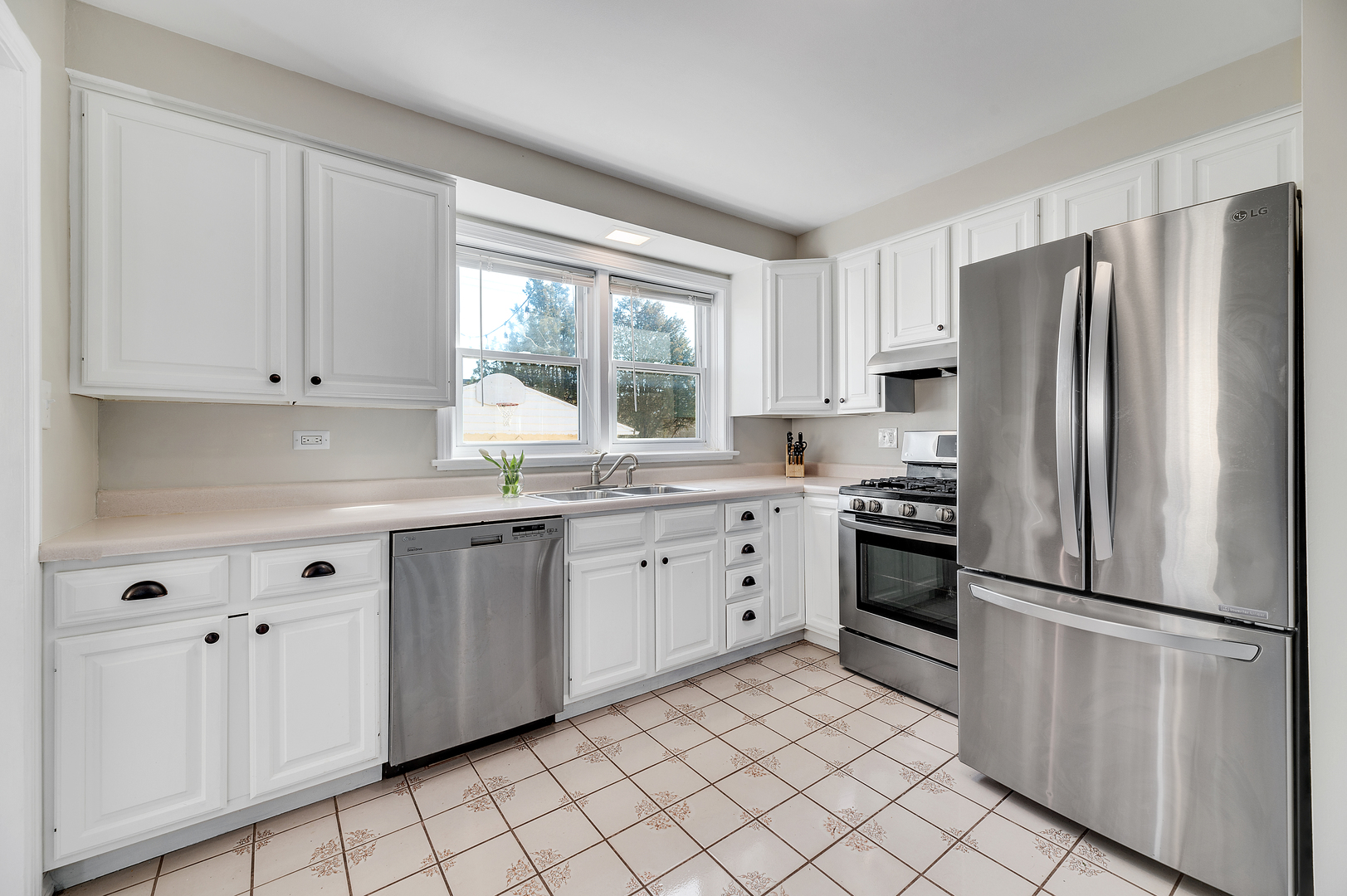 2309 2nd Avenue North Riverside, IL 60546 - Photo 10 of 22 a kitchen with stainless steel appliances granite countertop a refrigerator sink and stove