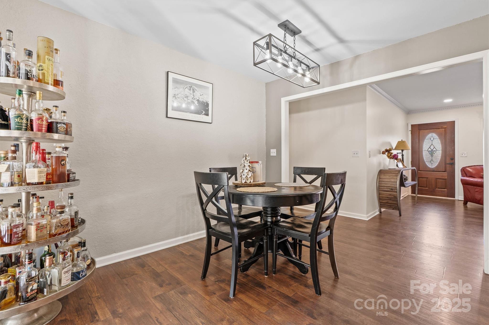 5645 Sandhurst Road Hickory, NC 28602 - Photo 15 of 46 a view of a dining room with furniture and wooden floor