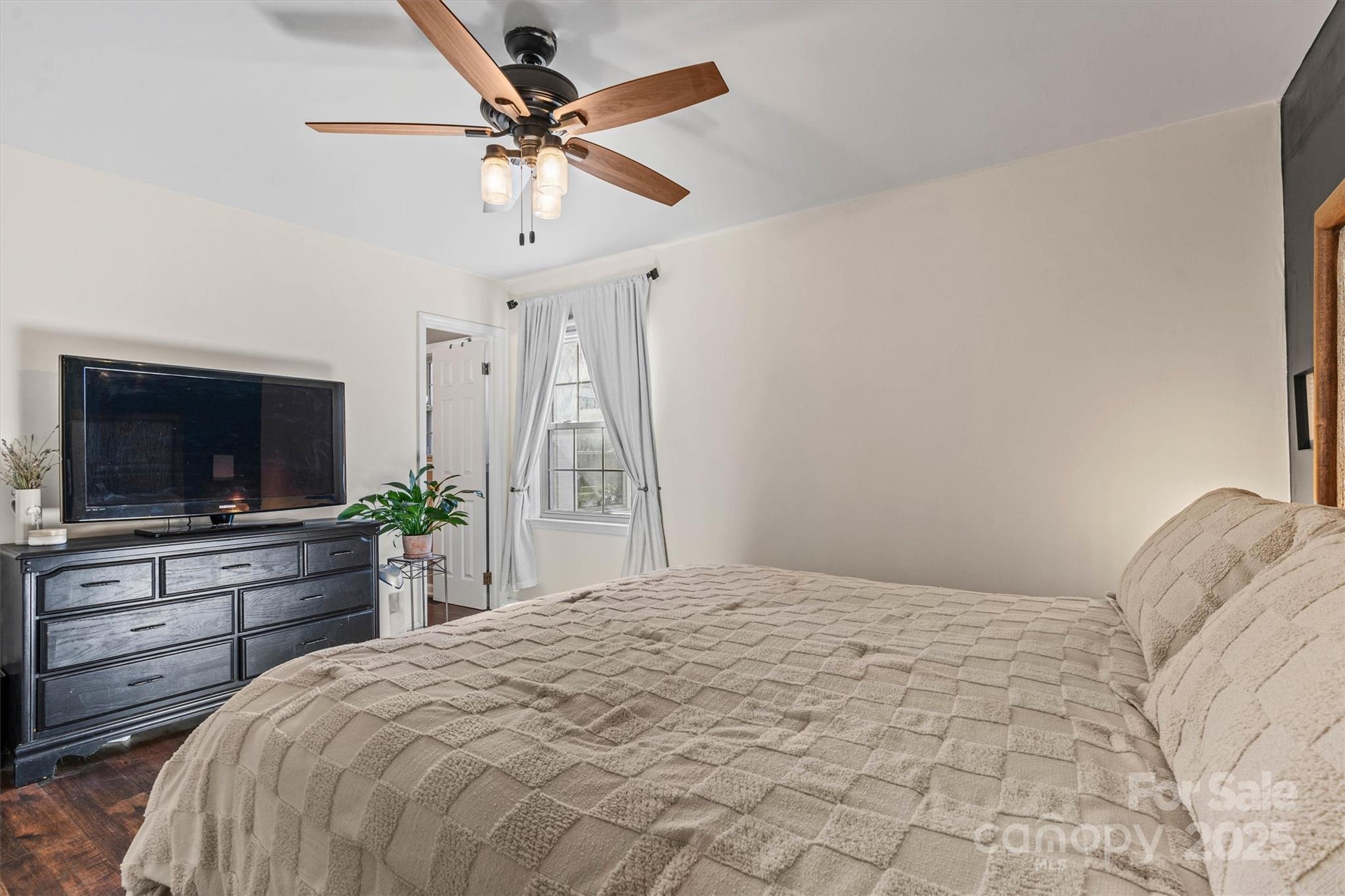 5645 Sandhurst Road Hickory, NC 28602 - Photo 19 of 46 a bedroom with a bed and a flat screen tv