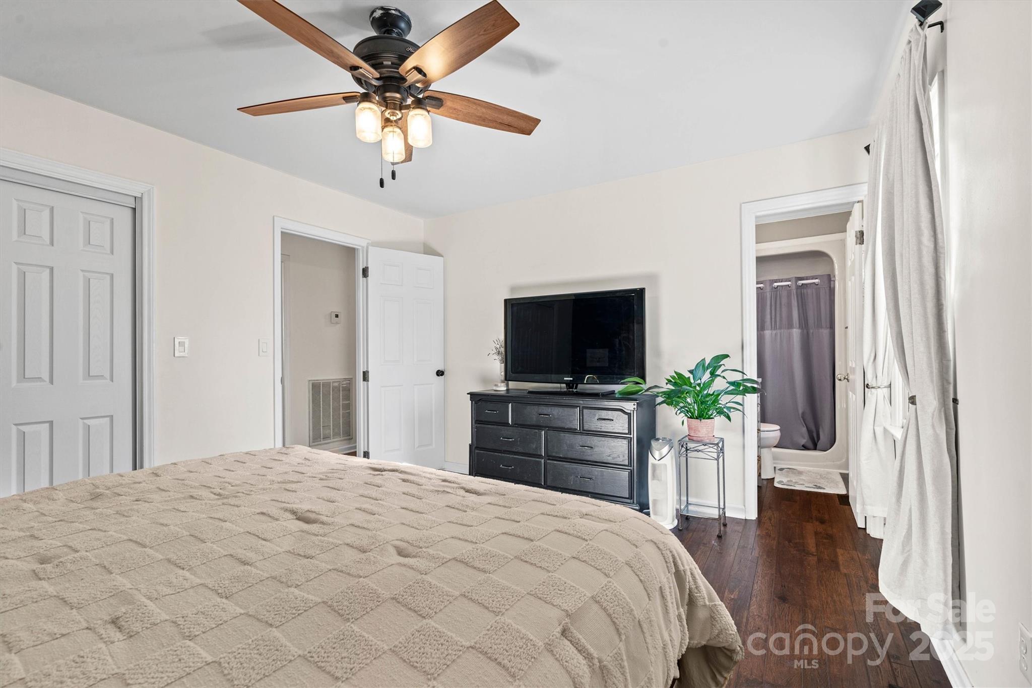 5645 Sandhurst Road Hickory, NC 28602 - Photo 20 of 46 a bedroom with a bed and a flat screen tv
