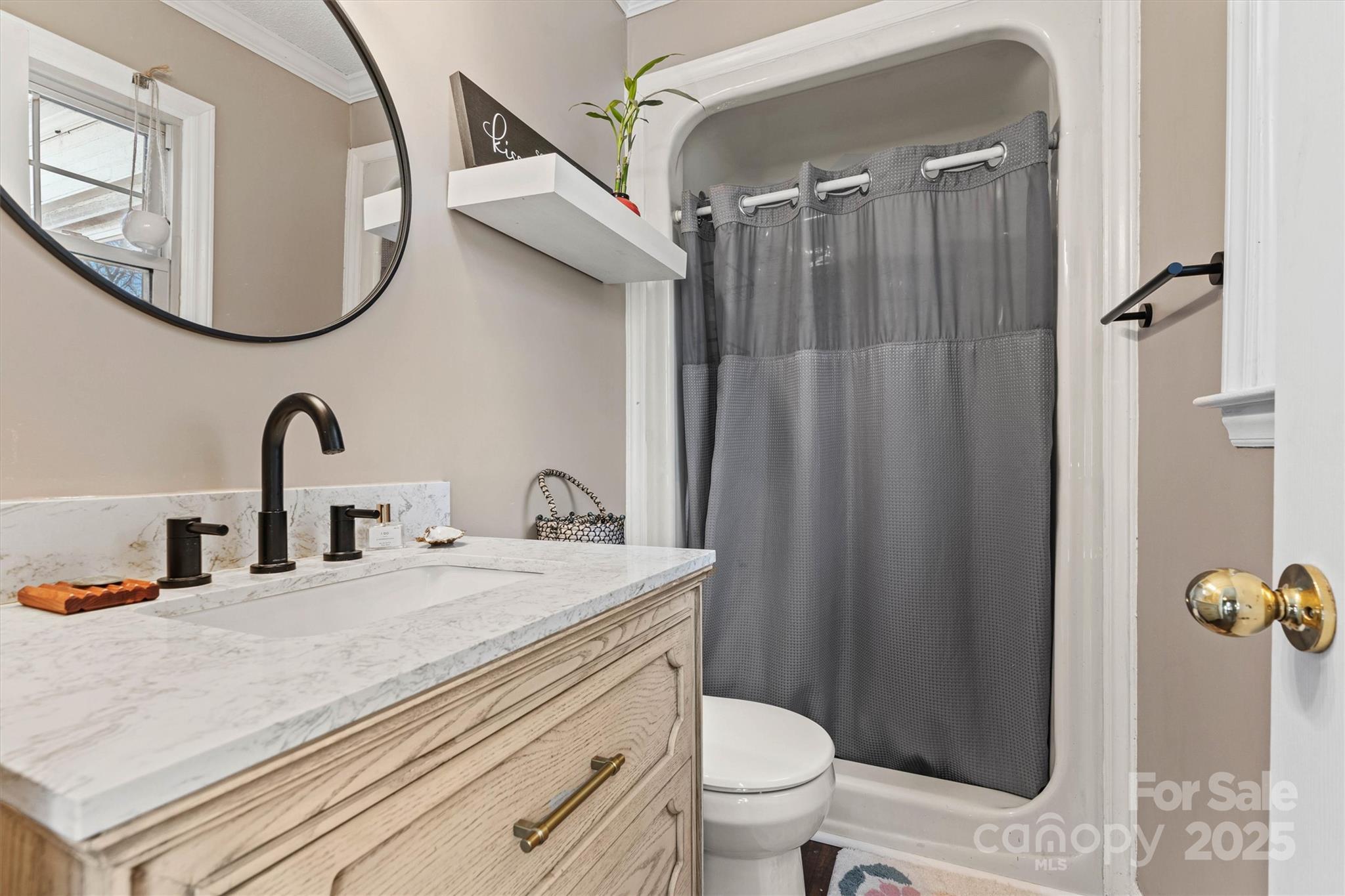 5645 Sandhurst Road Hickory, NC 28602 - Photo 21 of 46 a bathroom with a sink and mirror