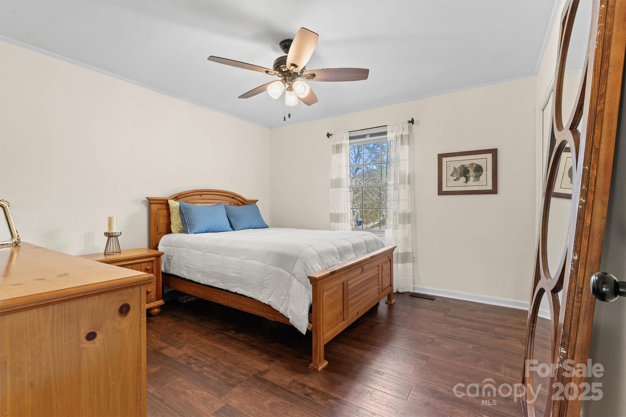 5645 Sandhurst Road Hickory, NC 28602 - Photo 22 of 46 a bedroom with a bed and a chandelier