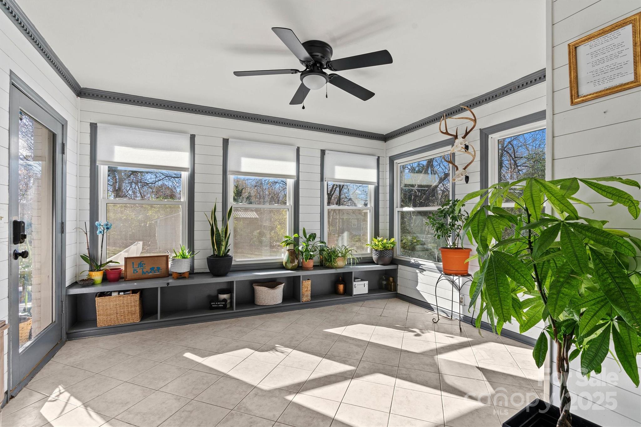 5645 Sandhurst Road Hickory, NC 28602 - Photo 27 of 46 a living room with patio furniture and a potted plant