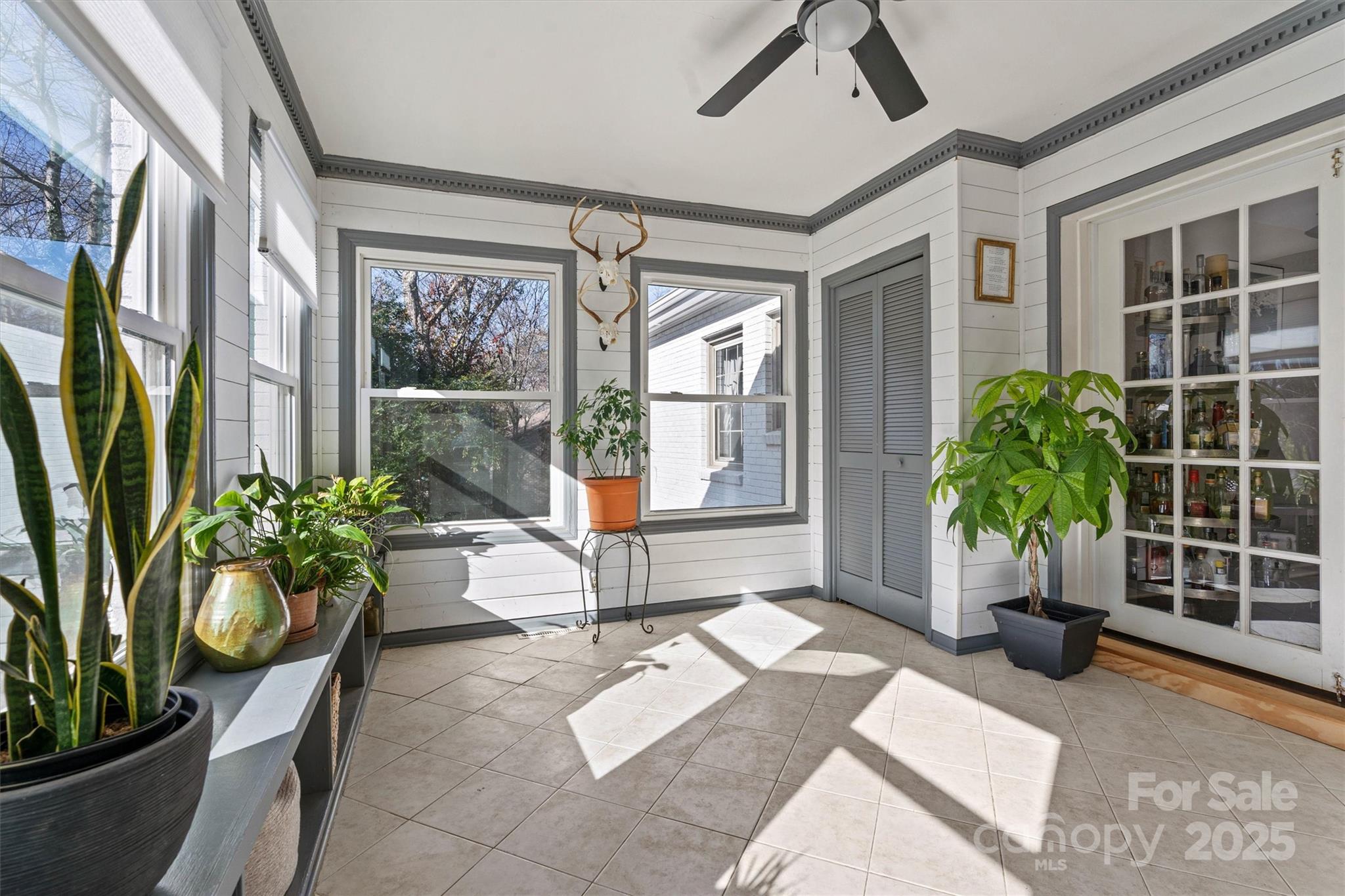 5645 Sandhurst Road Hickory, NC 28602 - Photo 28 of 46 a living room filled with furniture and a potted plant