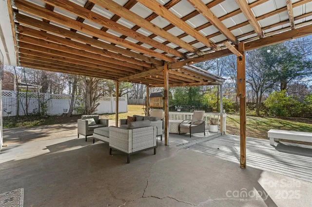 a view of living room with couch and chairs