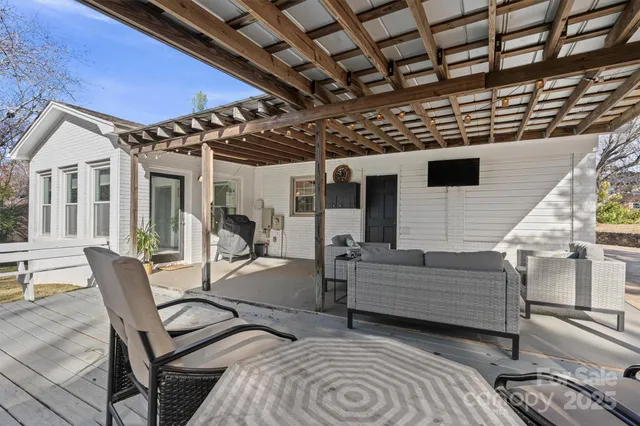 a view of a porch with furniture and a table
