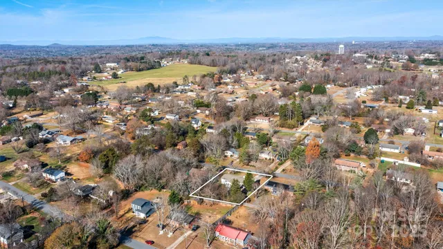an aerial view of residential building with parking space
