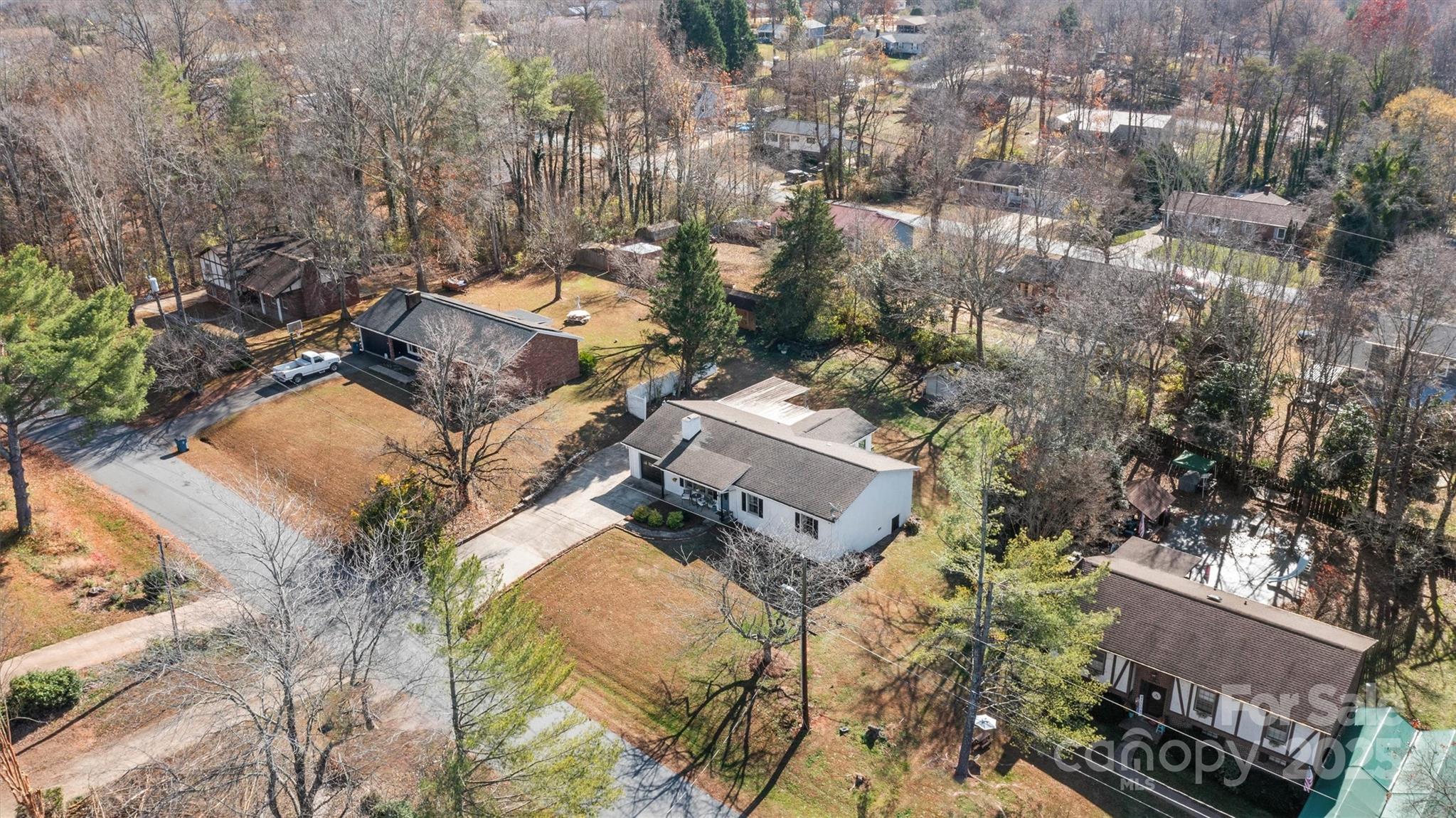 5645 Sandhurst Road Hickory, NC 28602 - Photo 43 of 46 an aerial view of a house with a yard and trees