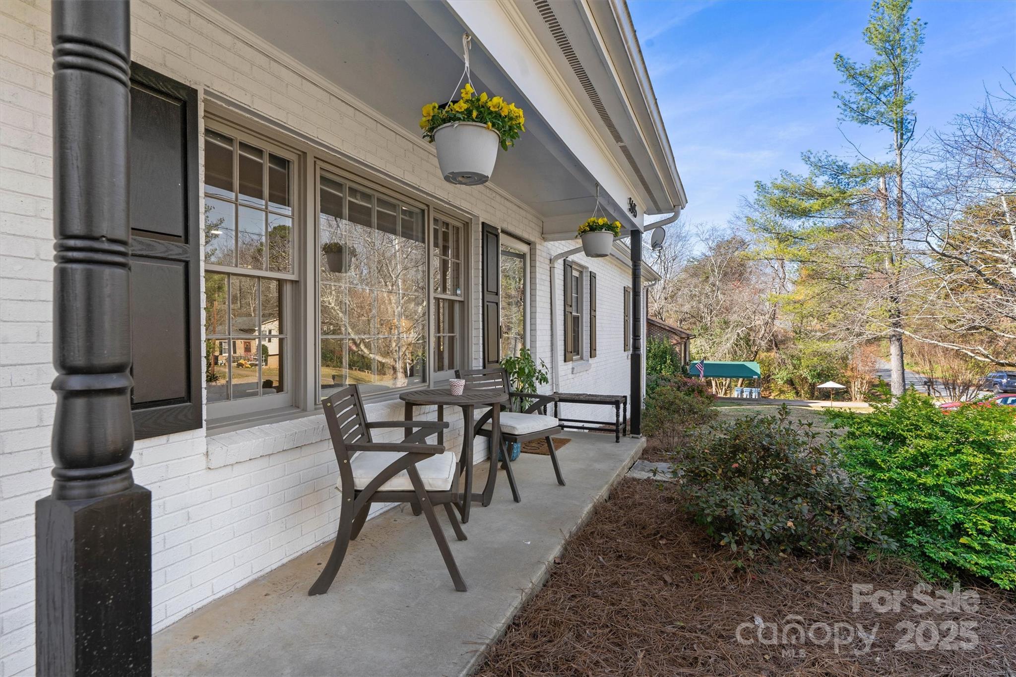 5645 Sandhurst Road Hickory, NC 28602 - Photo 44 of 46 a view of a patio with table and chairs and potted plants