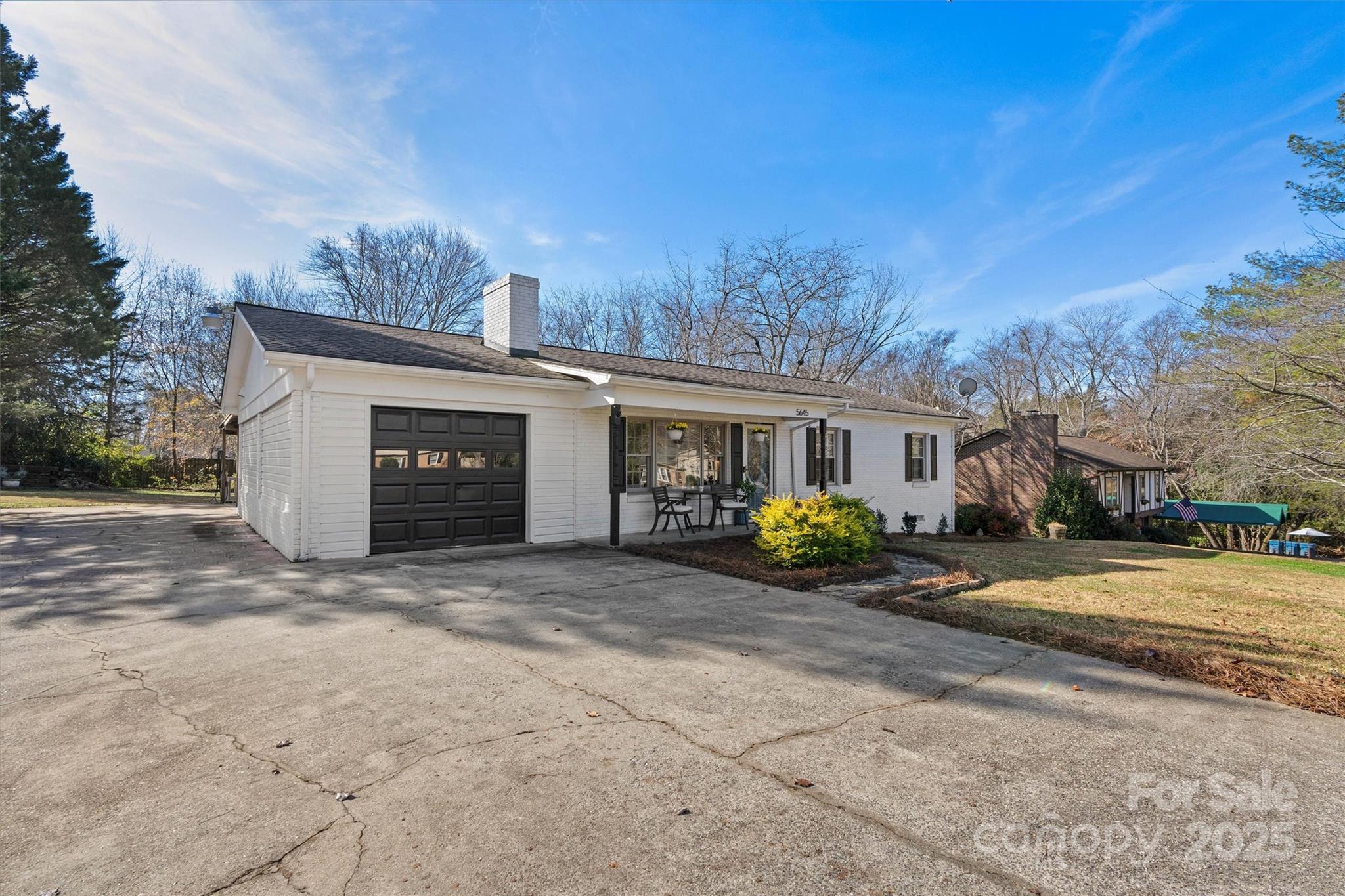 5645 Sandhurst Road Hickory, NC 28602 - Photo 45 of 46 a front view of a house with a yard and garage
