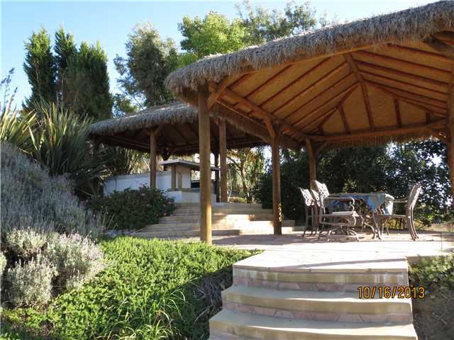 4221 Fallsbrae Road Fallbrook, CA 92028 - Photo 16 of 21 Custom palapas cover dining area & outdoor kitchen.
