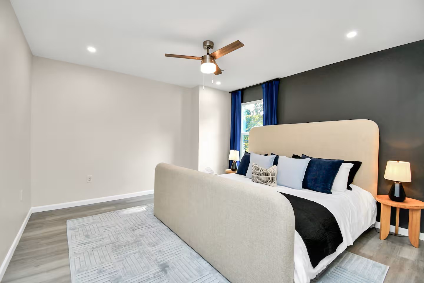 3318 Wichita Street Houston, TX 77004 - Photo 28 of 36 a bed room with a bed and a ceiling fan
