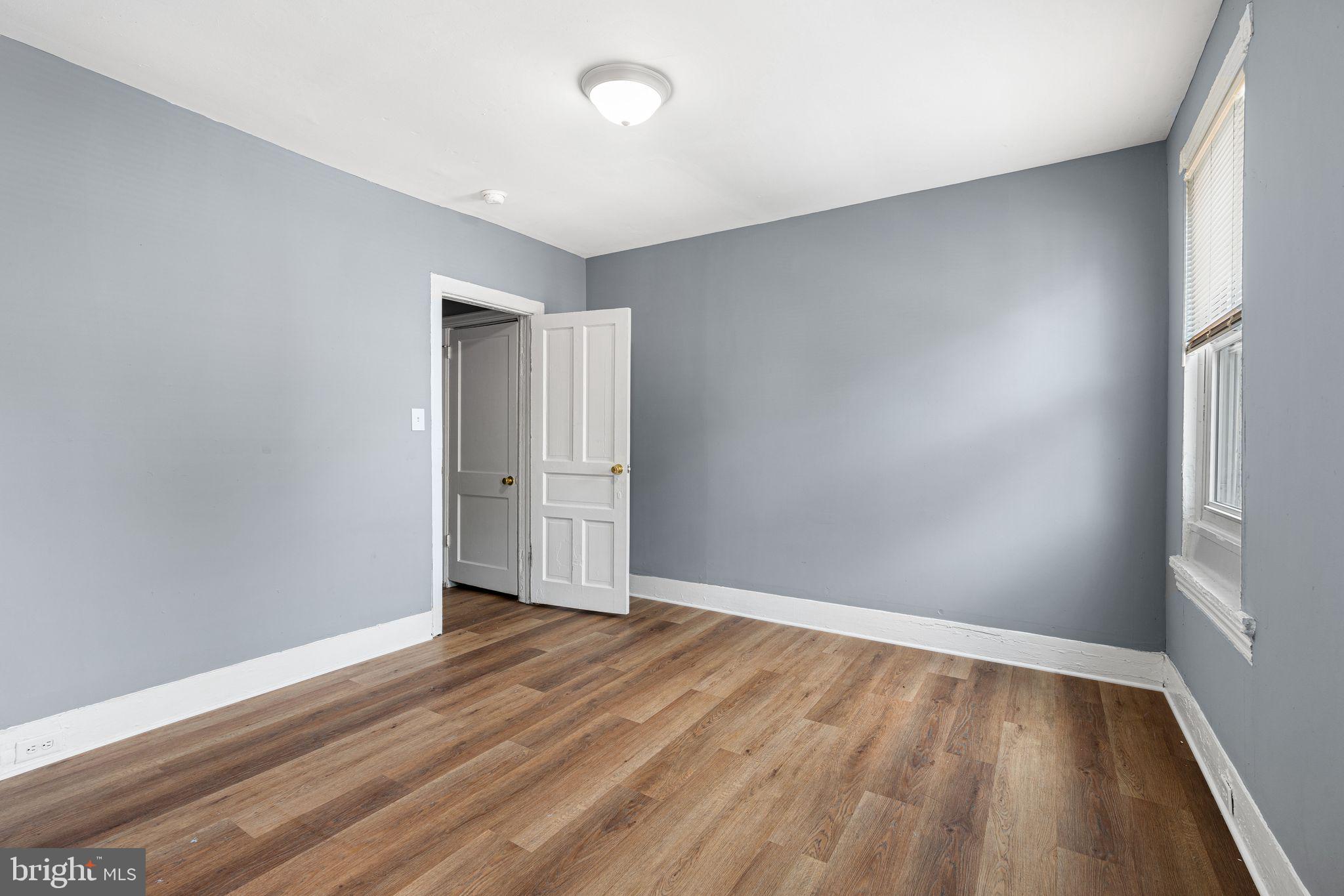 452 Mechanic Street Philadelphia, PA 19144 - Photo 11 of 32 a view of an empty room with wooden floor and a window