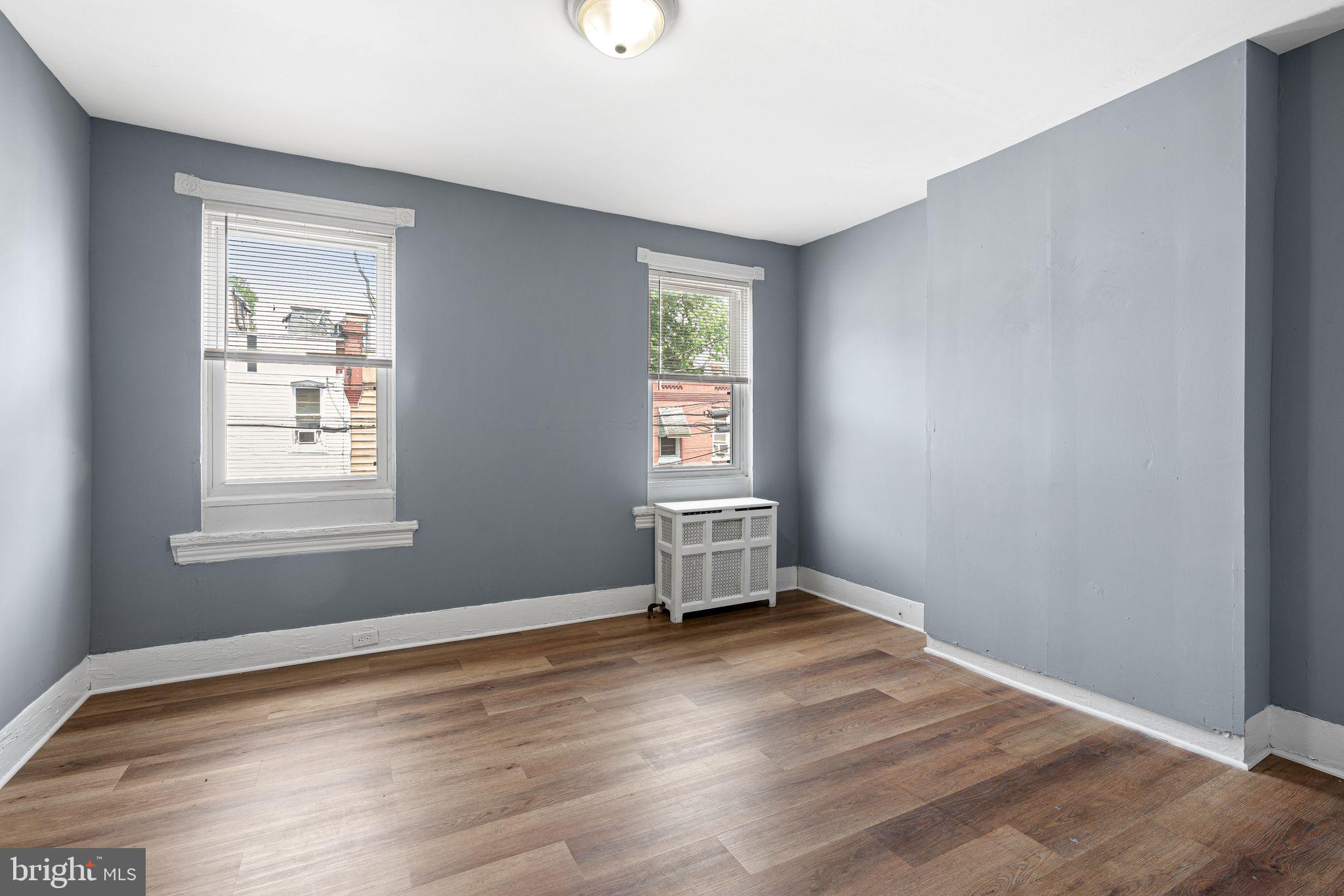 452 Mechanic Street Philadelphia, PA 19144 - Photo 12 of 32 a view of an empty room with wooden floor and a window