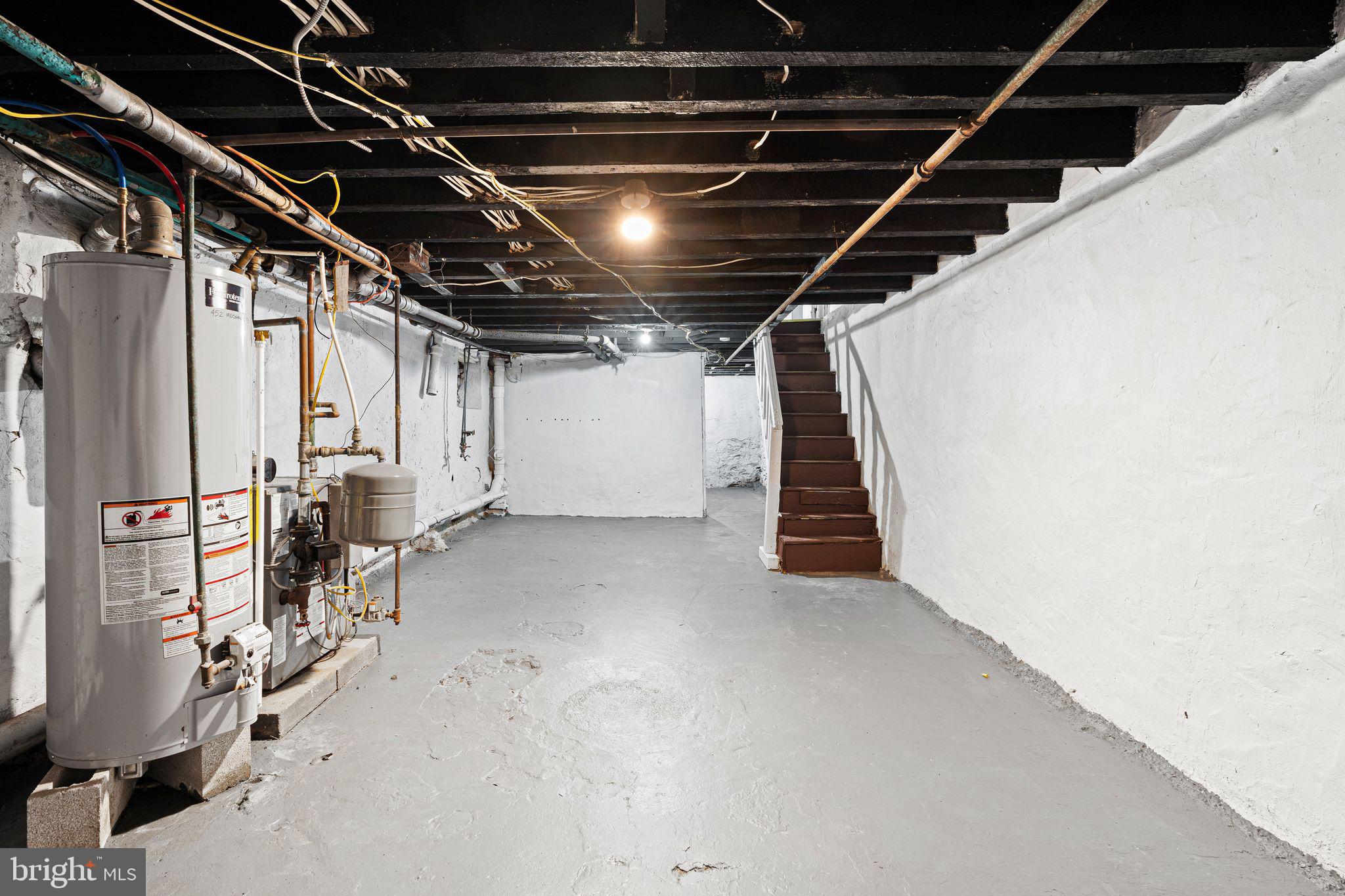 452 Mechanic Street Philadelphia, PA 19144 - Photo 18 of 32 a view of an empty room with wooden stairs