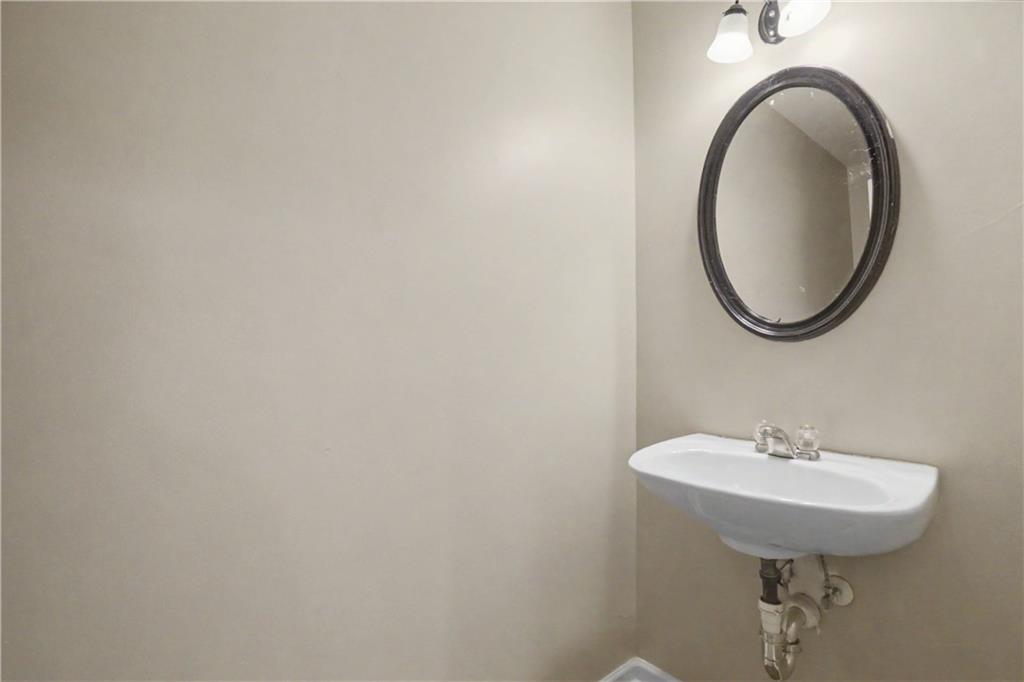 375 Walton View Fairburn, GA 30213 - Photo 17 of 38 a bathroom with a sink and a mirror