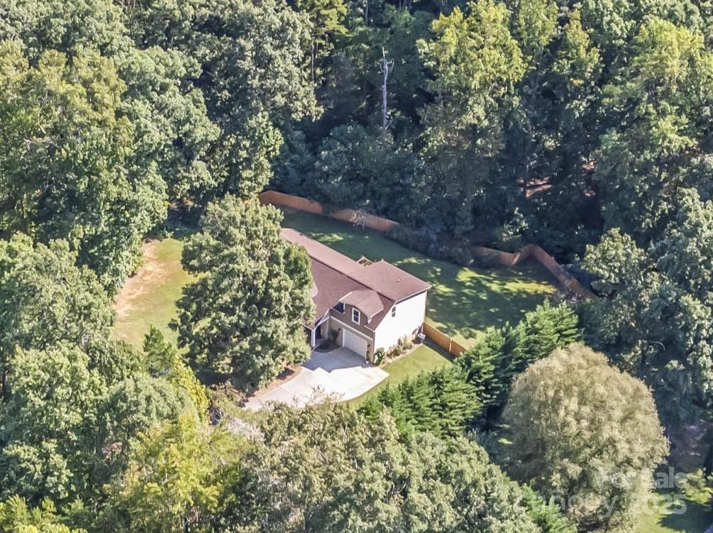 an aerial view of residential house with outdoor space