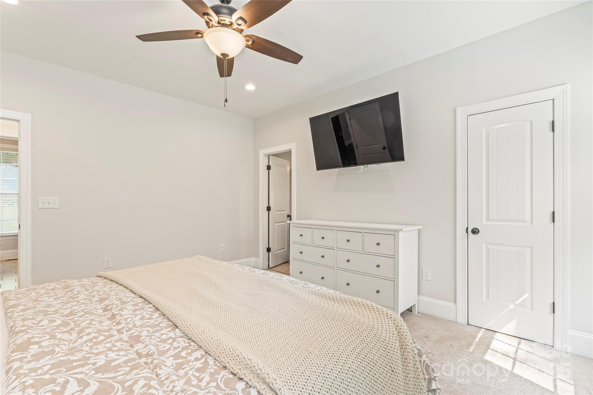 2775 Beechwood Road Denver, NC 28037 - Photo 17 of 33 a bedroom with a bed and a flat screen tv