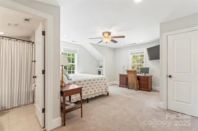 a bedroom with furniture and a window