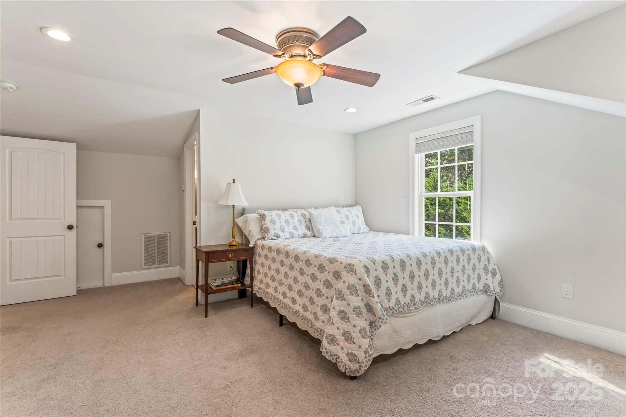 2775 Beechwood Road Denver, NC 28037 - Photo 24 of 33 a bedroom with a bed and a ceiling fan