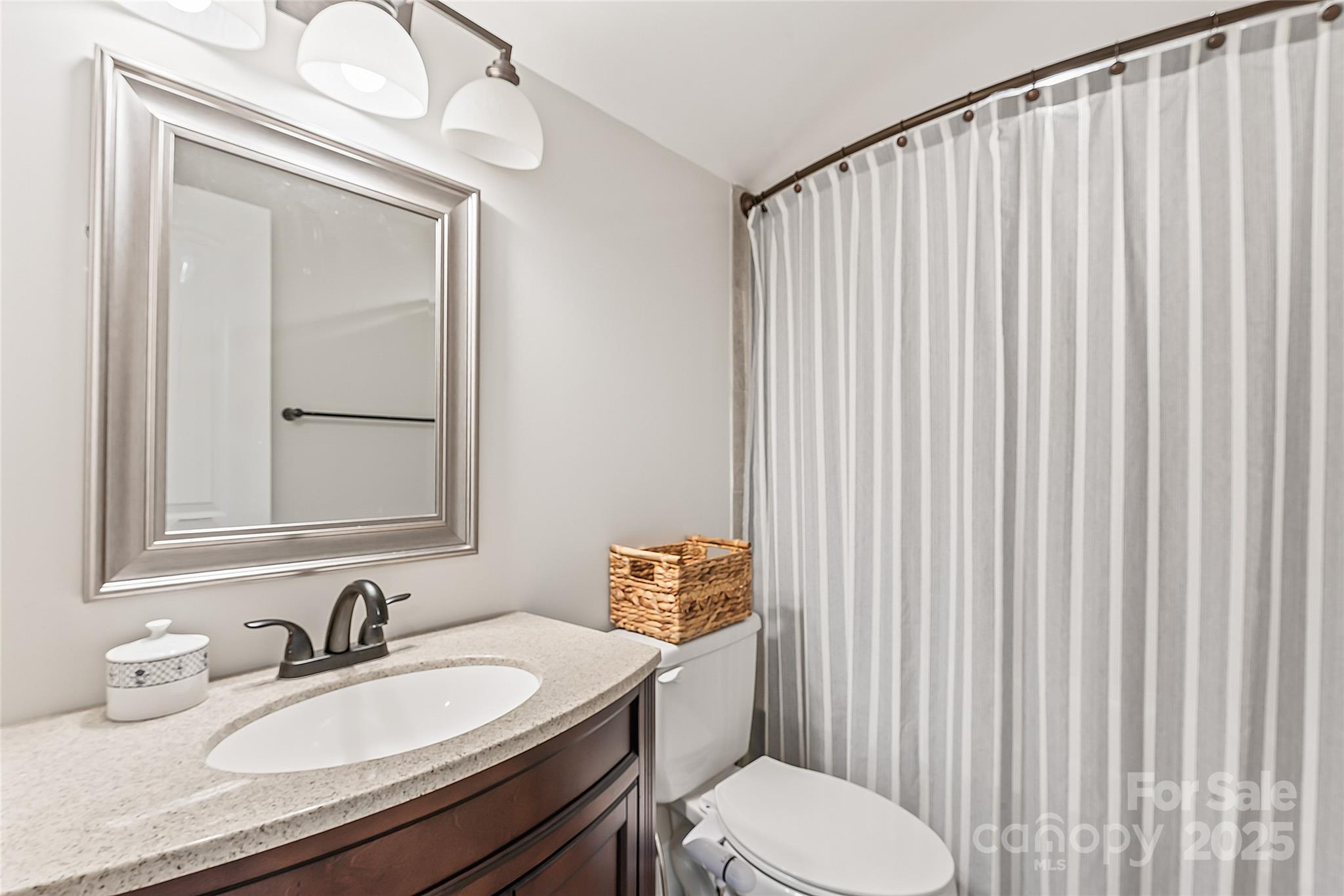 2775 Beechwood Road Denver, NC 28037 - Photo 25 of 33 a bathroom with a granite countertop bathtub sink vanity mirror and toilet