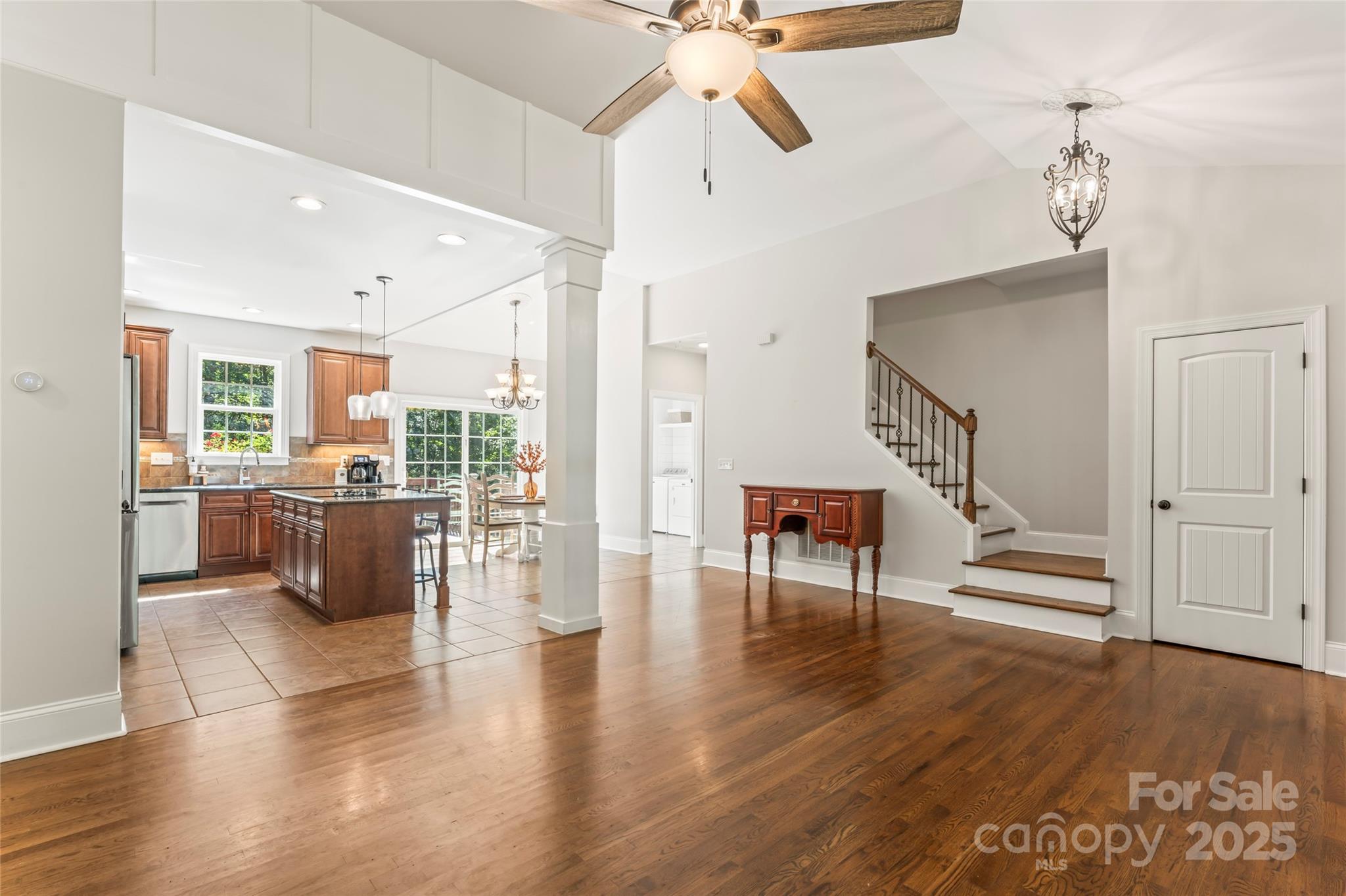 2775 Beechwood Road Denver, NC 28037 - Photo 5 of 33 a living room with couches chairs and kitchen view with wooden floor