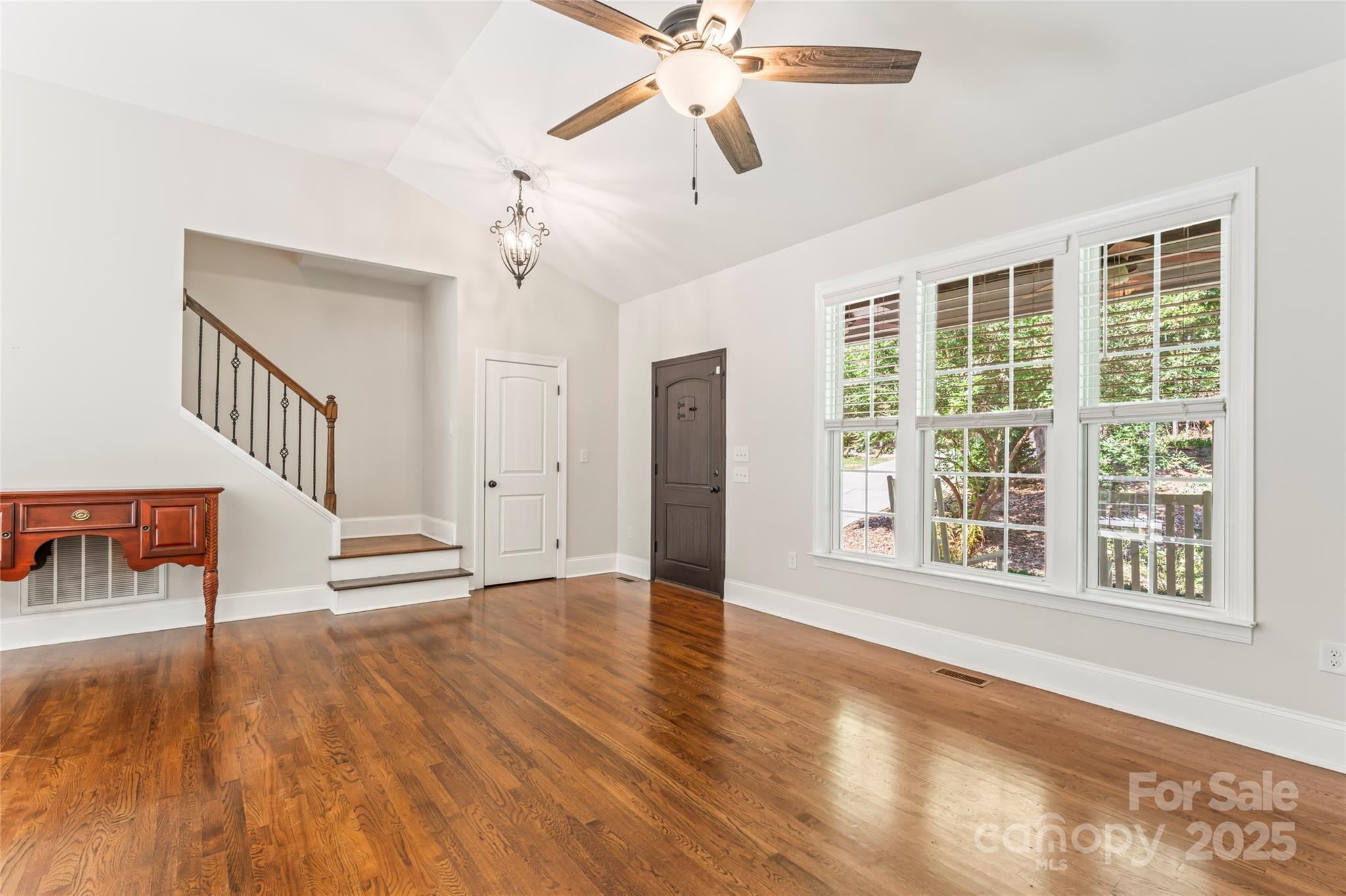 2775 Beechwood Road Denver, NC 28037 - Photo 6 of 33 a view of an entryway with wooden floor and a ceiling fan
