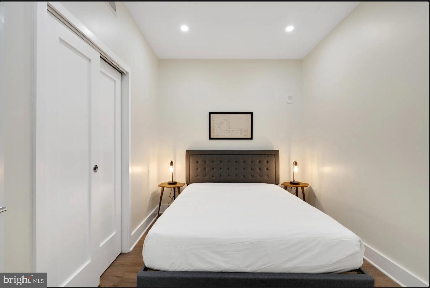 150 South Independence Mall West, Unit 1013 Philadelphia, PA 19106 - Photo 13 of 16 a bed sitting in a bedroom next to a bathroom