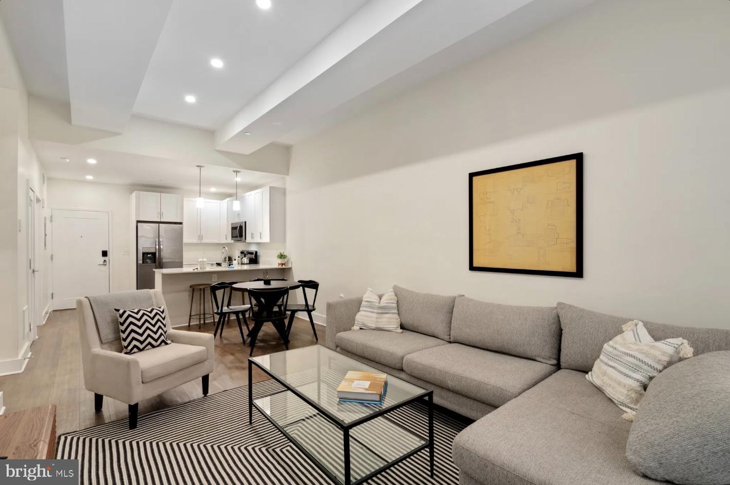 150 South Independence Mall West, Unit 1013 Philadelphia, PA 19106 - Photo 3 of 16 a living room with furniture a rug and a table