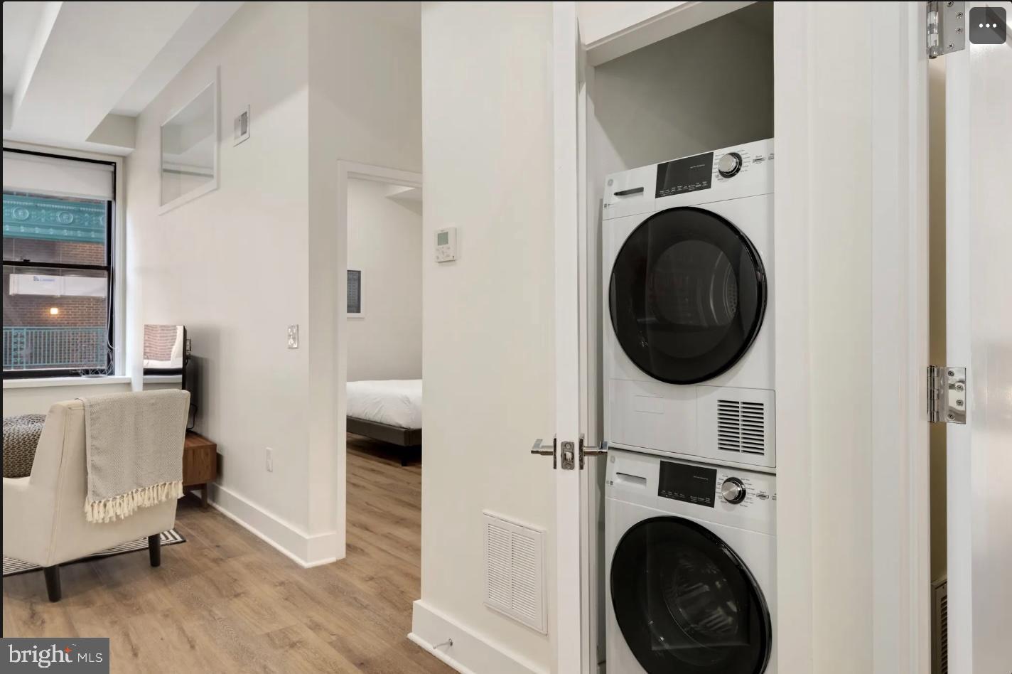 150 South Independence Mall West, Unit 1013 Philadelphia, PA 19106 - Photo 4 of 16 a view of a hallway with washer and dryer