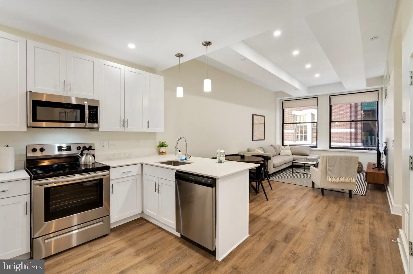 150 South Independence Mall West, Unit 1013 Philadelphia, PA 19106 - Photo 5 of 16 a kitchen with sink stove and cabinets