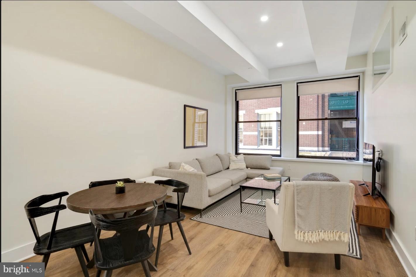 150 South Independence Mall West, Unit 1013 Philadelphia, PA 19106 - Photo 8 of 16 a living room with furniture and a window