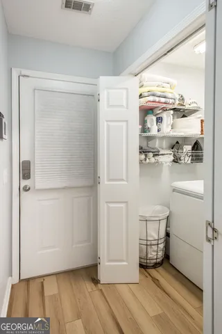 a view of kitchen with furniture and wooden floor