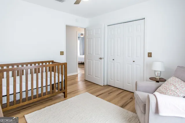 a view of a room with a table and chairs