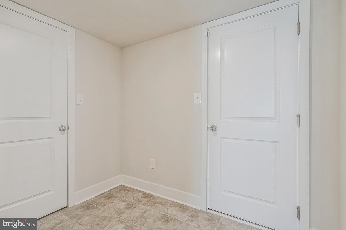 23606 Crosswinds Way California, MD 20619 - Photo 33 of 40 Door to garage and closet