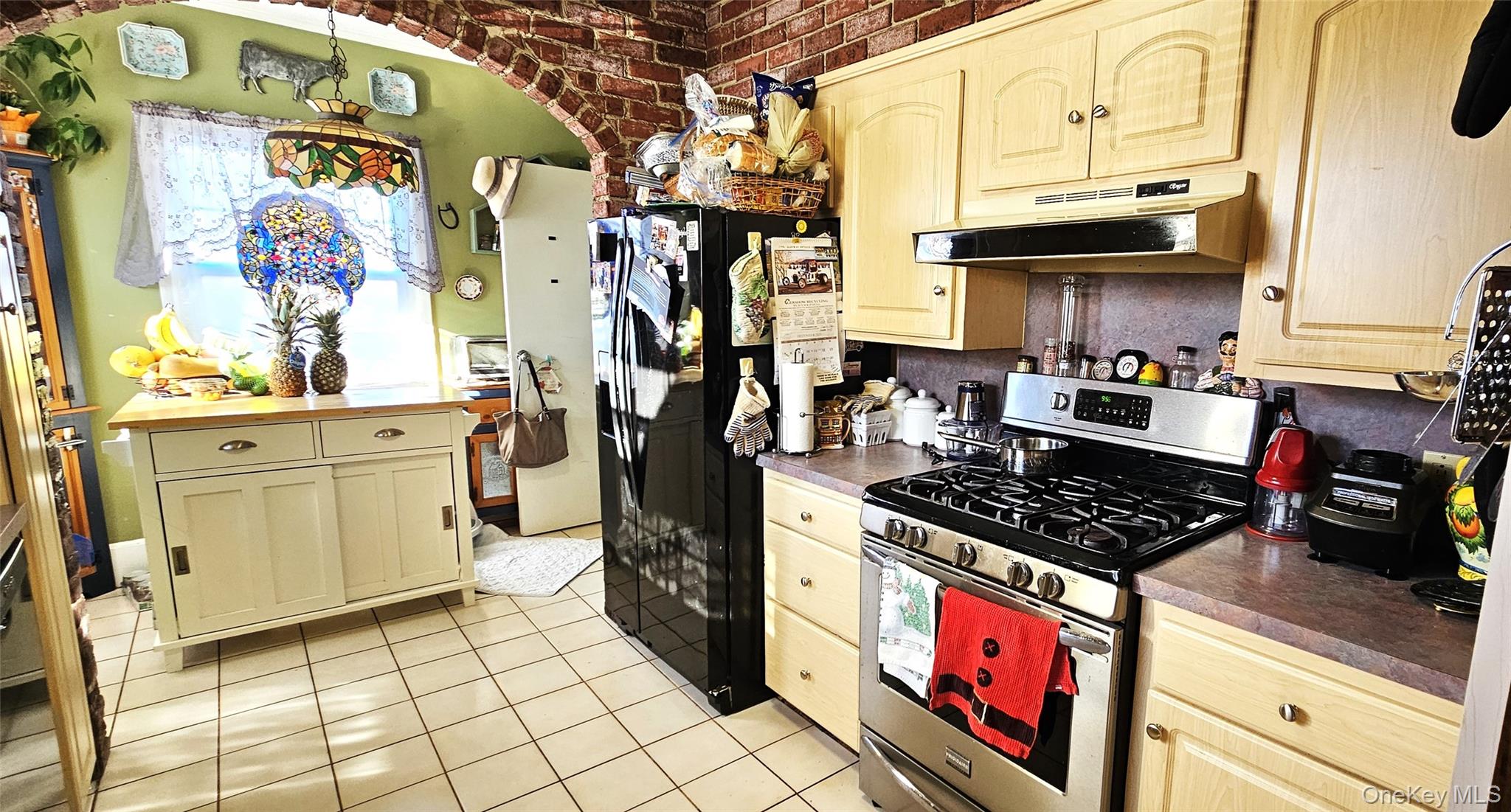 80 Dobson Avenue Merrick, NY 11566 - Photo 12 of 21 a kitchen with stainless steel appliances granite countertop a stove and cabinets