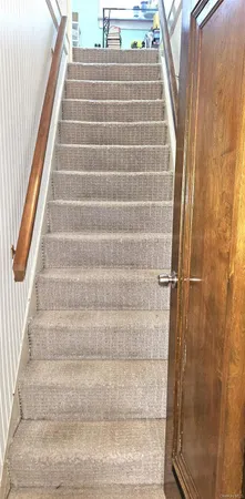 a view of staircase with white walls