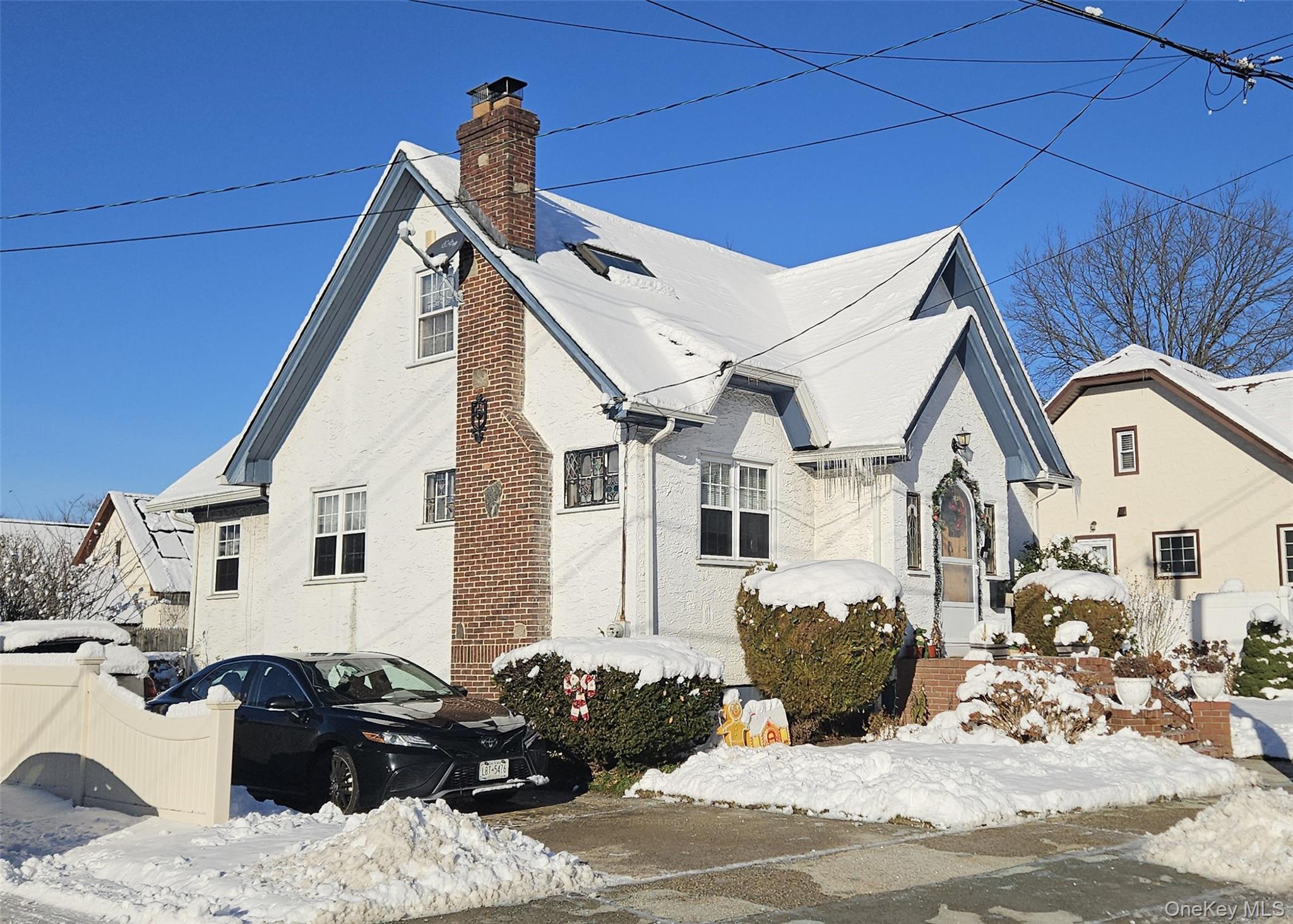 80 Dobson Avenue Merrick, NY 11566 - Photo 2 of 21 a view of a white house with a outdoor space